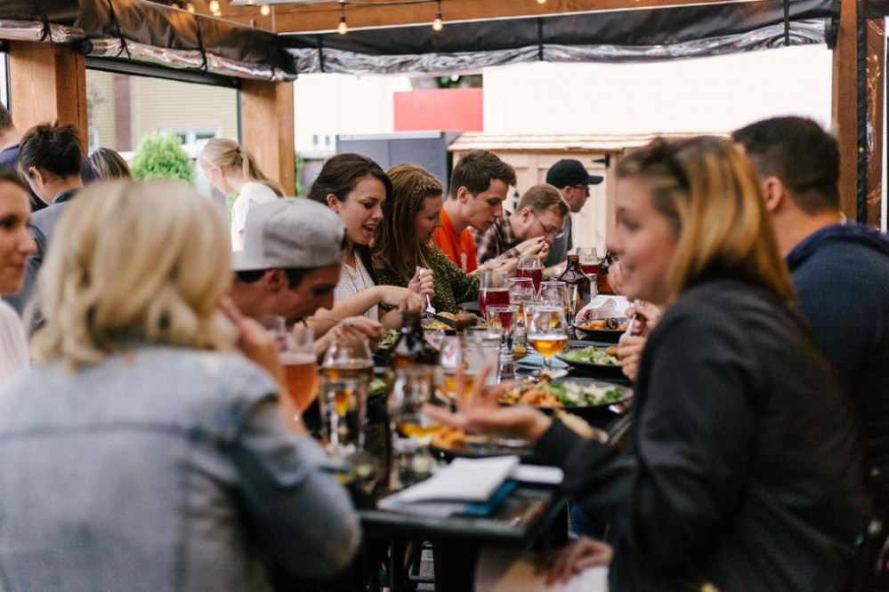People out for drinks sat at a table
