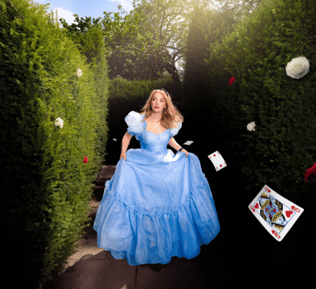 A woman in a blue dress in a maze
